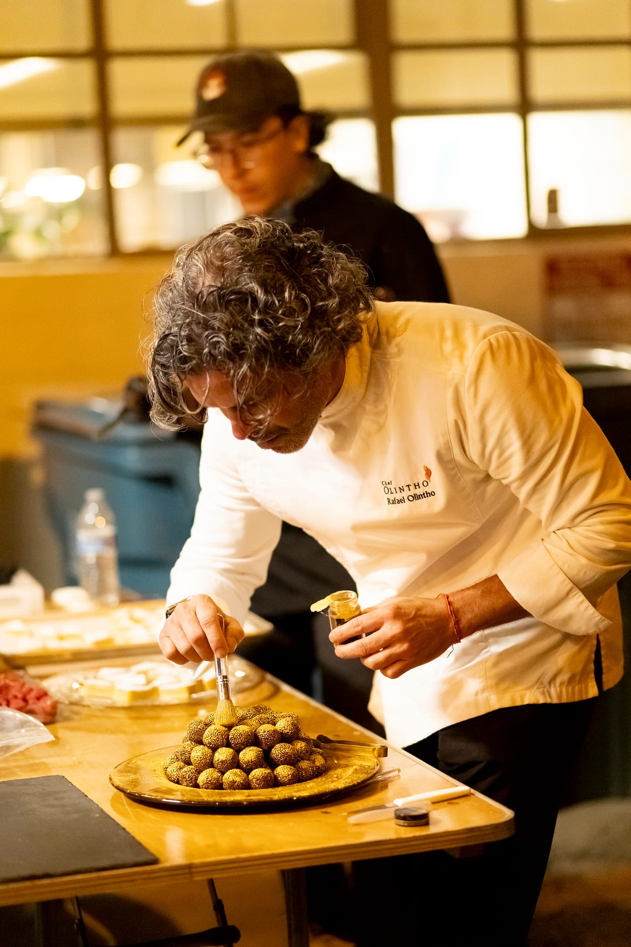 Personal chef Rafael Olintho preparing gourmet Brazilian desserts